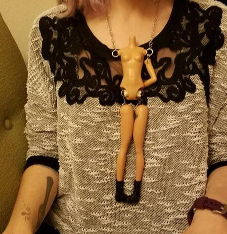 A one armed disarticulated Barbie with her boots on